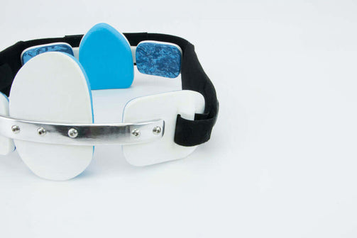 Pectus brace male with white panels and blue foam. Back close up