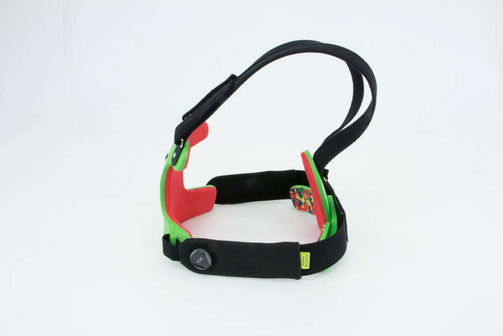 Pectus brace female with green panels and red foam. Side view